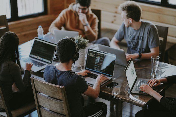 SaaS team working on laptops