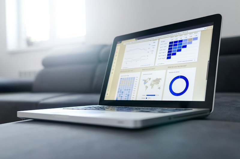 Laptop with charts on a desk